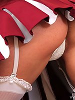 Curly brunette chick in white stockings and cheerleader uniform (Nicola R)